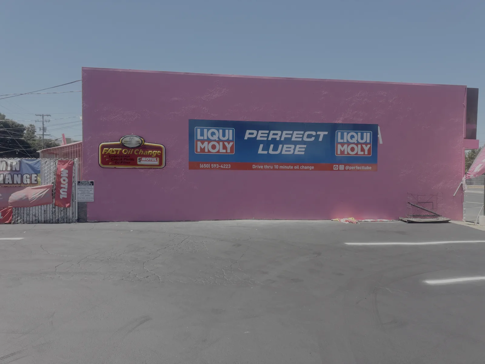 Freshly repainted Perfect Lube building in San Carlos with new Liqui Moly and Motul signage